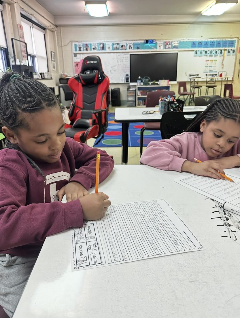 Students working on writing assignments